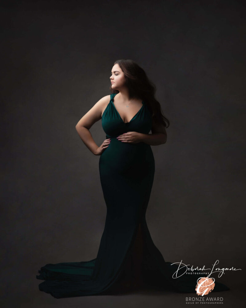 woman posed in infinity maternity dress by rosa amour