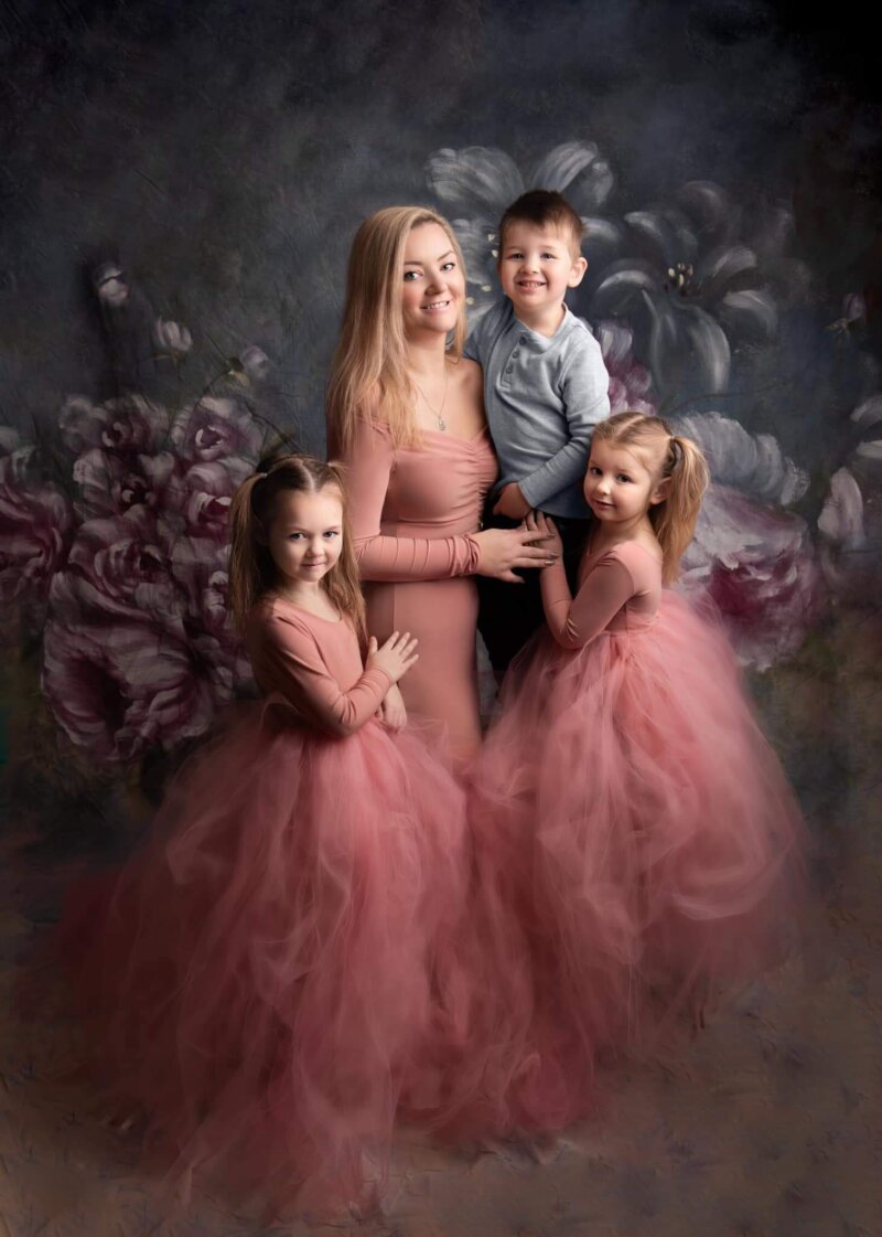 family portrait daughters and mother wearing pink rosa amour dresses