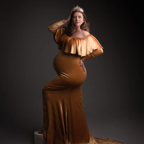 Pregnant women wearing crown and velvet yellow dress by rosa amour