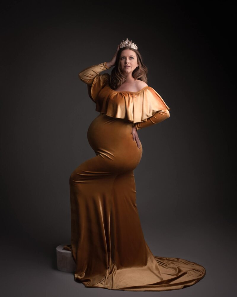 Pregnant women wearing crown and velvet yellow dress by rosa amour