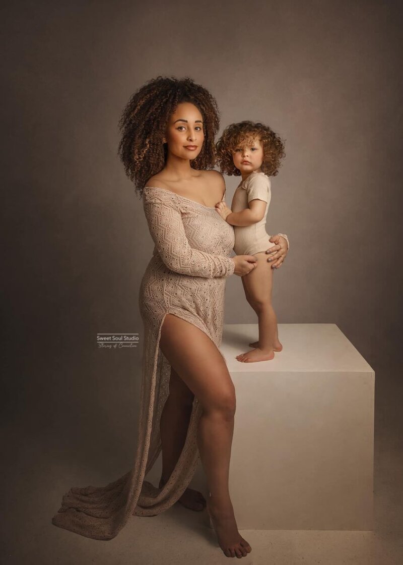 Mother and child posed wearing rosa amour crochet dress