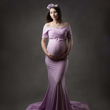 women posed holding bump wearing lilac rosa amour dress