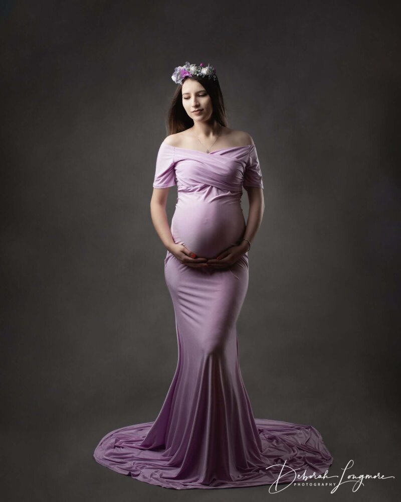 women posed holding bump wearing lilac rosa amour dress