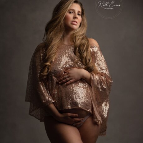 Pregnant women wearing rose pink sequin cape/shawl by Rosa Amour