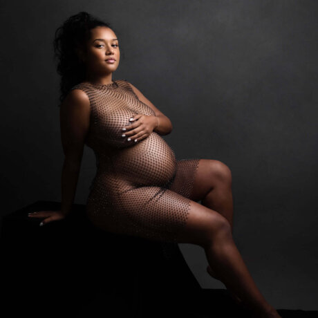 Pregnant women posed wear fishnet diamonte cover