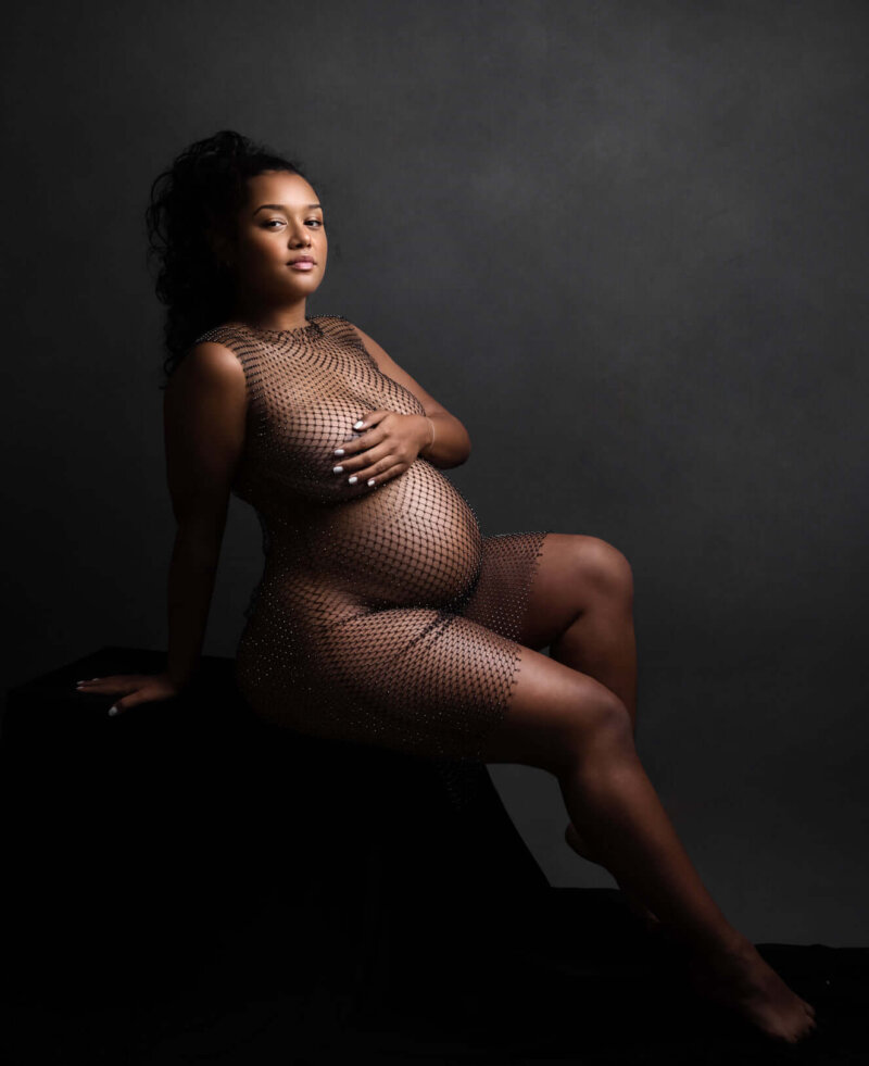 Pregnant women posed wear fishnet diamonte cover