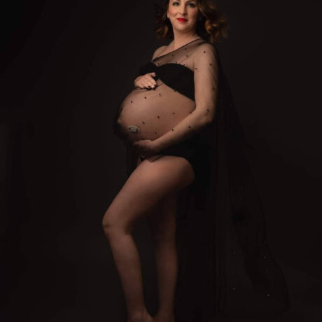 pregnant women wearing a drop shoulder cape /shawl in black by rosa amour