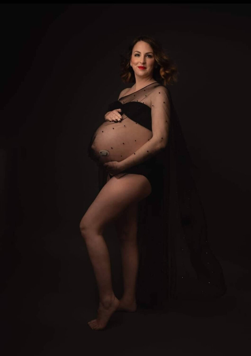 pregnant women wearing a drop shoulder cape /shawl in black by rosa amour