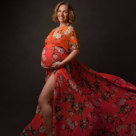 Pregnant women wearing floral maternity dress by rosa amour