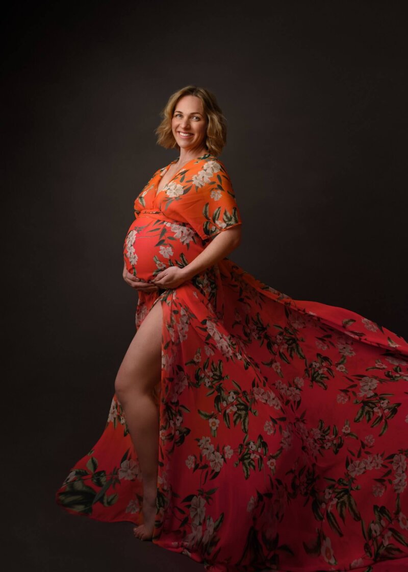 Pregnant women wearing floral maternity dress by rosa amour