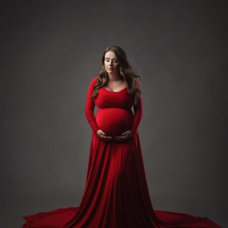 Women wearing maternity red dress by rosa amour