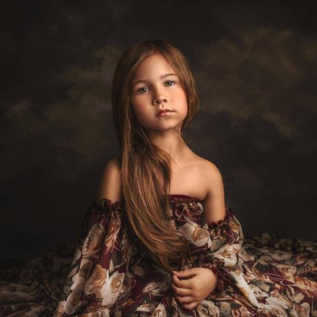 little girl posing in floral wine dress by rosa amour