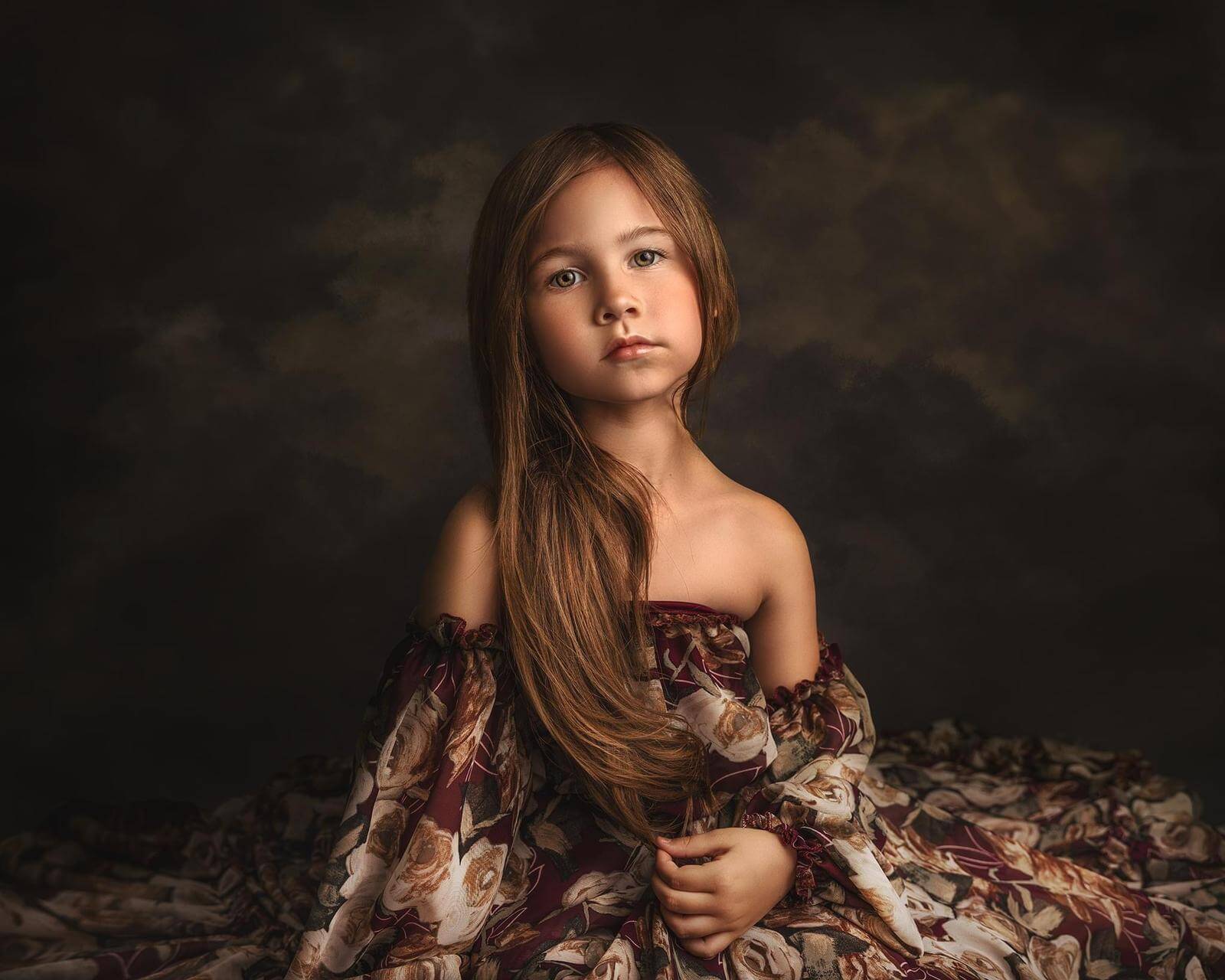 little girl posing in floral wine dress by rosa amour