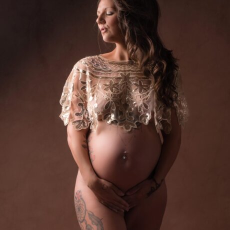 pregnant lady wearing floral sequin cape/shawl by rosa amour
